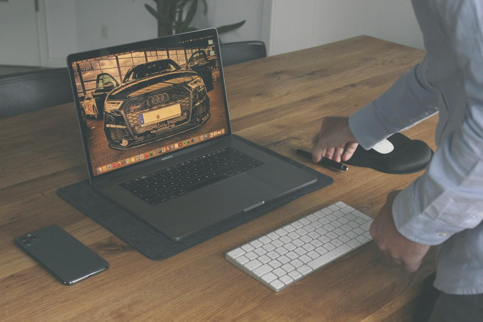 Development environment setup with multiple monitors showing keyword analysis tools