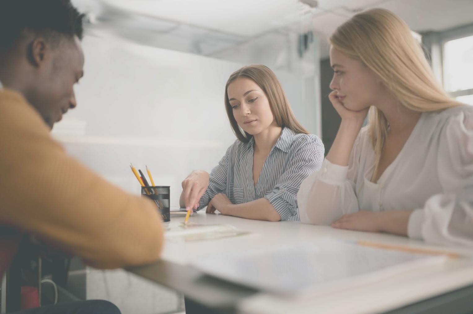 Students collaborating on keyword research projects using advanced analytics tools